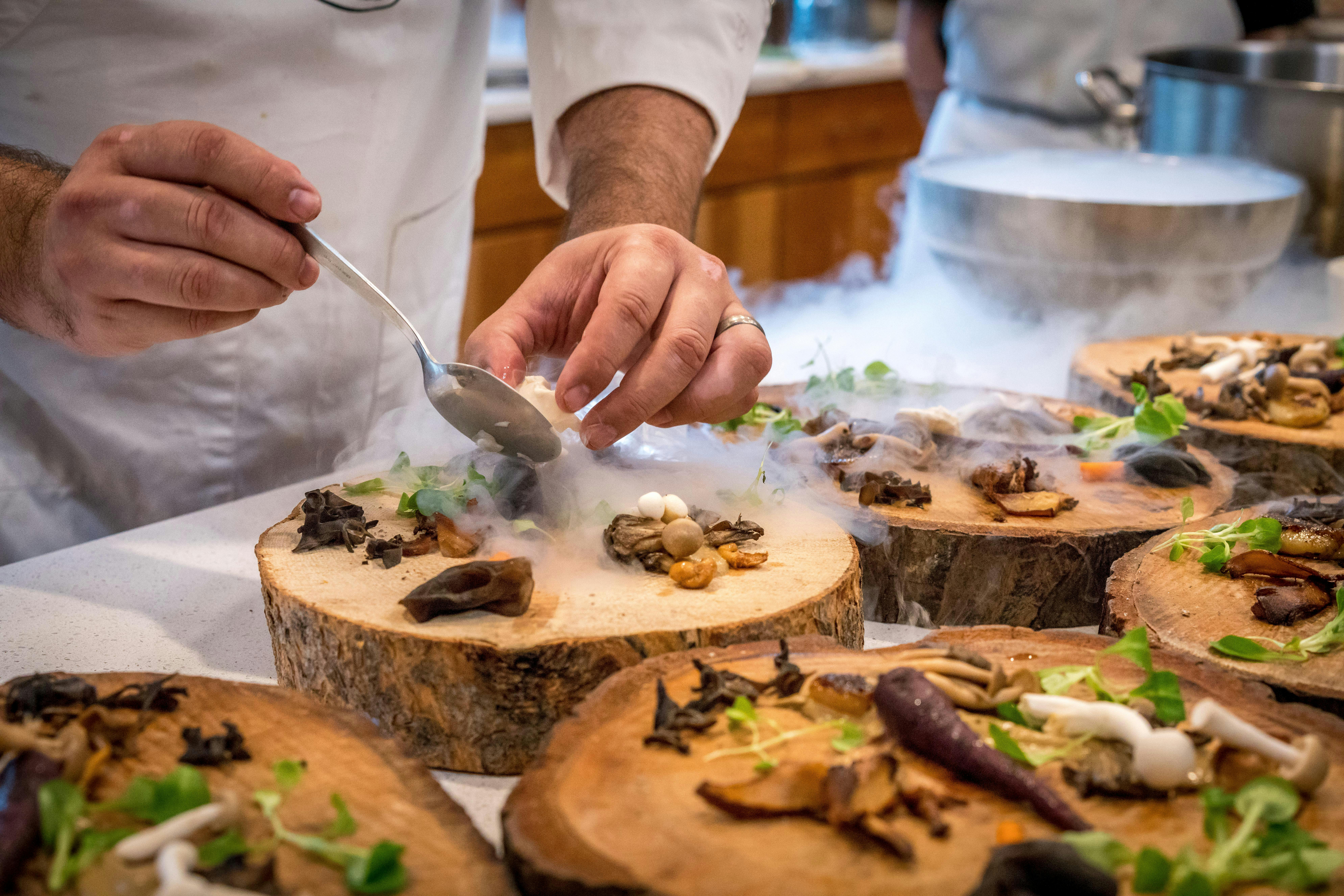A chef plating a dish.